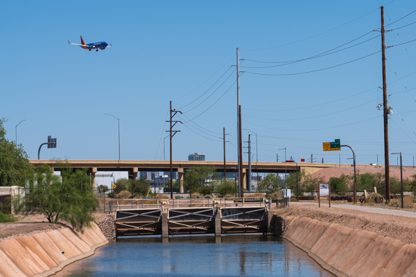 Image of airplane passing over Grand Canal near Phoenix Sky Harbor Airport